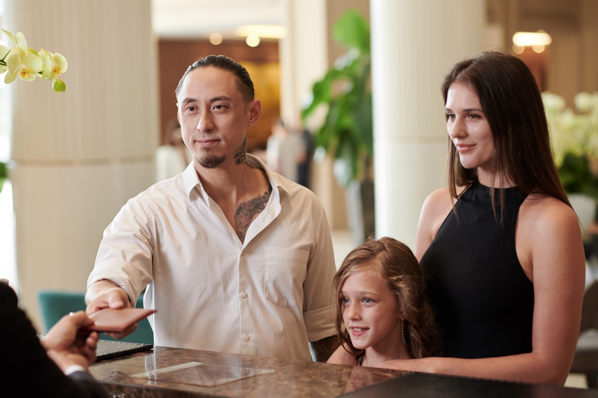 Giving Passports to Hotel Receptionist